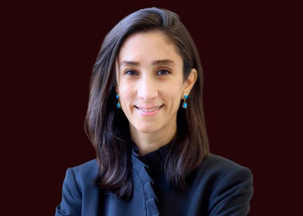 Professional woman in business attire, representing smart health decisions and healthcare technology.