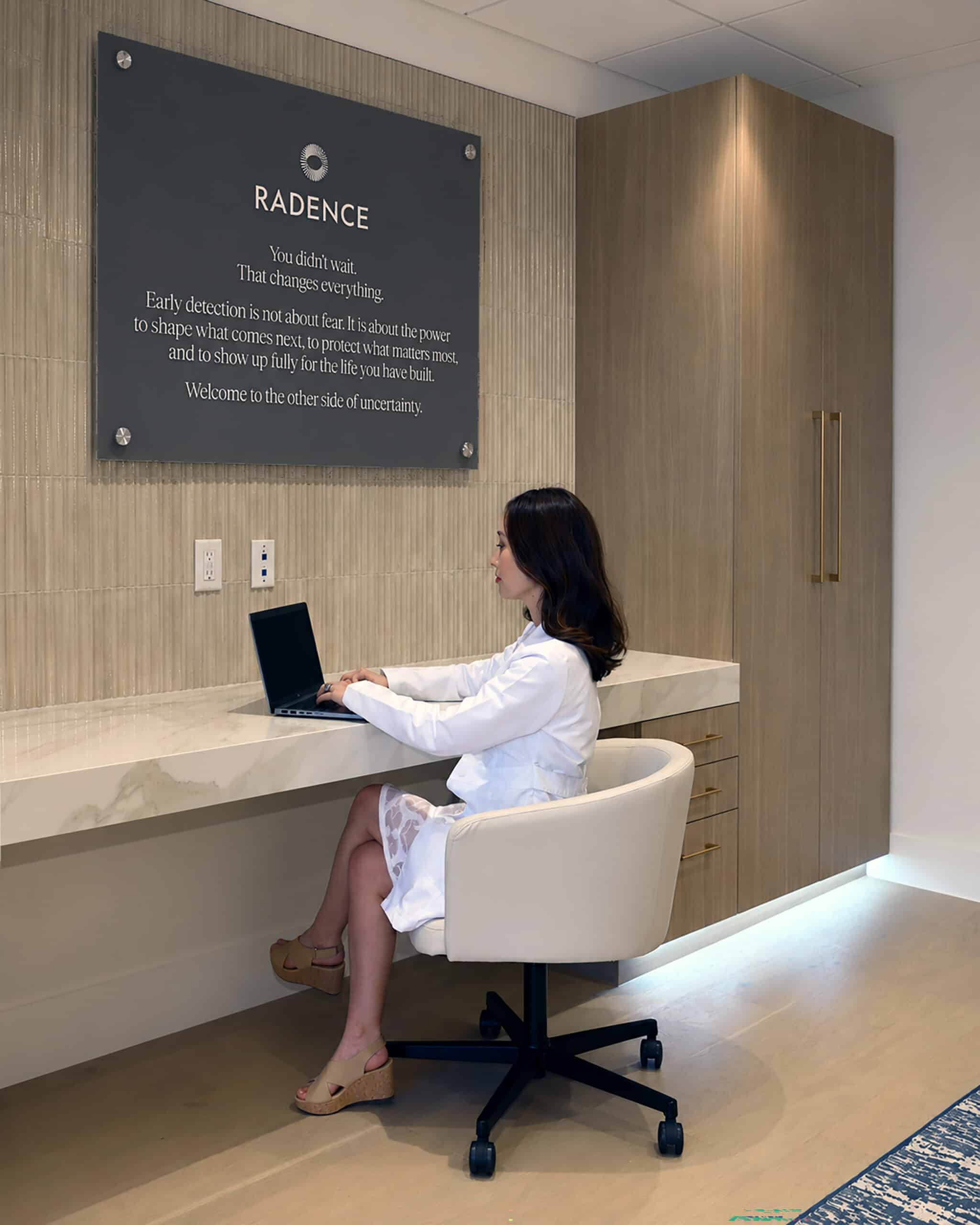 Radence clinician working on laptop in West Palm Beach Precision Health Hub
